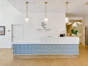 A beautifully crafted, custom reception desk at City Creek post acute care center.