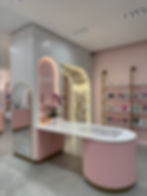 A Korean makeup store that features a floral selfie wall. 