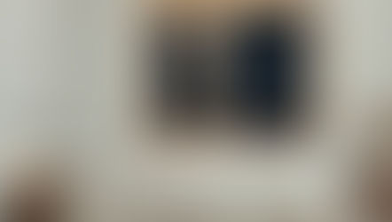 Cozy bedroom with white bedding, two wooden nightstands, and a lit lamp. Full moon and stars visible through open window, creating a serene mood.