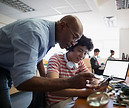 Teacher Assisting a Student