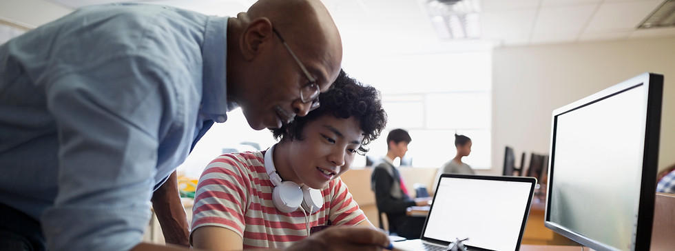 Teacher Assisting a Student