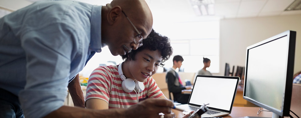 Teacher Assisting a Student