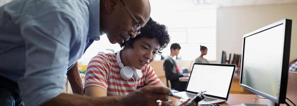 Teacher Assisting a Student