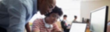 Teacher Assisting a Student