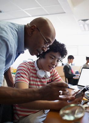 Teacher Assisting a Student