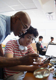 Teacher Assisting a Student