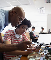 Teacher Assisting a Student
