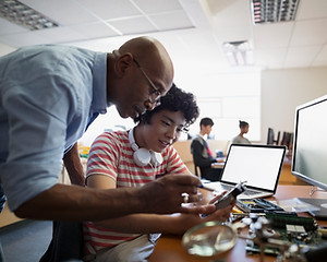 Teacher Assisting a Student