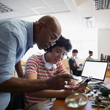 Teacher Assisting a Student
