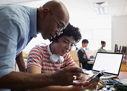 Teacher Assisting a Student