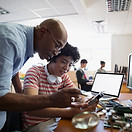 Teacher Assisting a Student