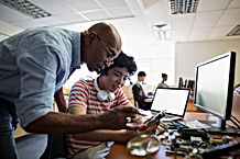Teacher Assisting a Student