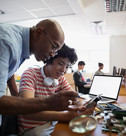 Teacher Assisting a Student