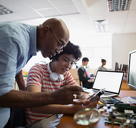 Teacher Assisting a Student