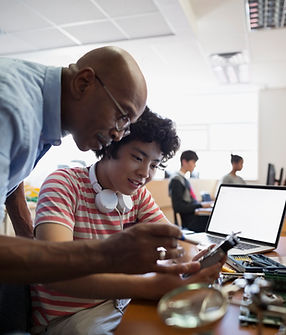 Teacher Assisting a Student