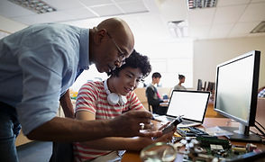 Teacher Assisting a Student