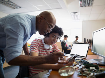 Teacher Assisting a Student