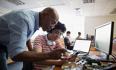 Teacher Assisting a Student