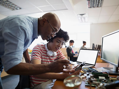 Teacher Assisting a Student