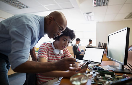 Teacher Assisting a Student