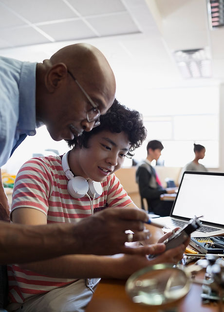Teacher Assisting a Student