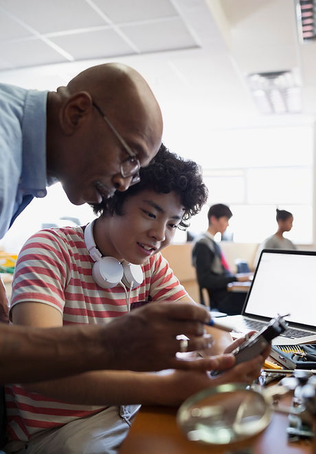 Teacher Assisting a Student