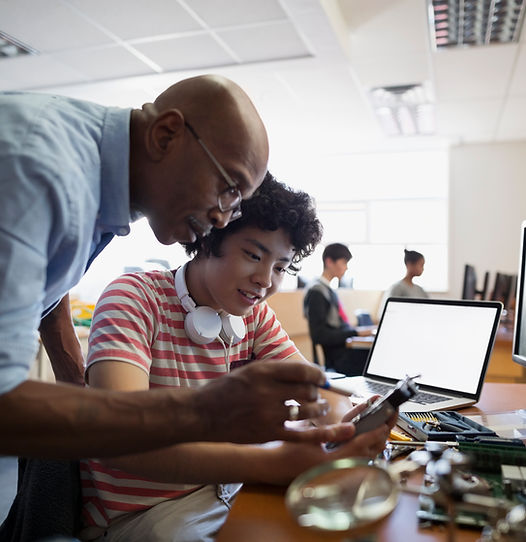 Teacher Assisting a Student