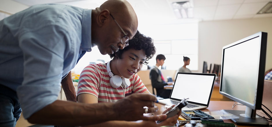 Teacher Assisting a Student