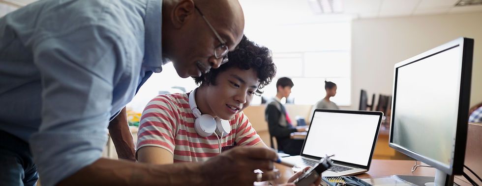 Teacher Assisting a Student