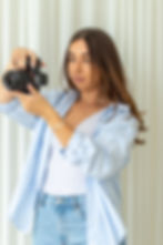 Hannah from Grid Socials preparing camera for a client photoshoot in Dorset