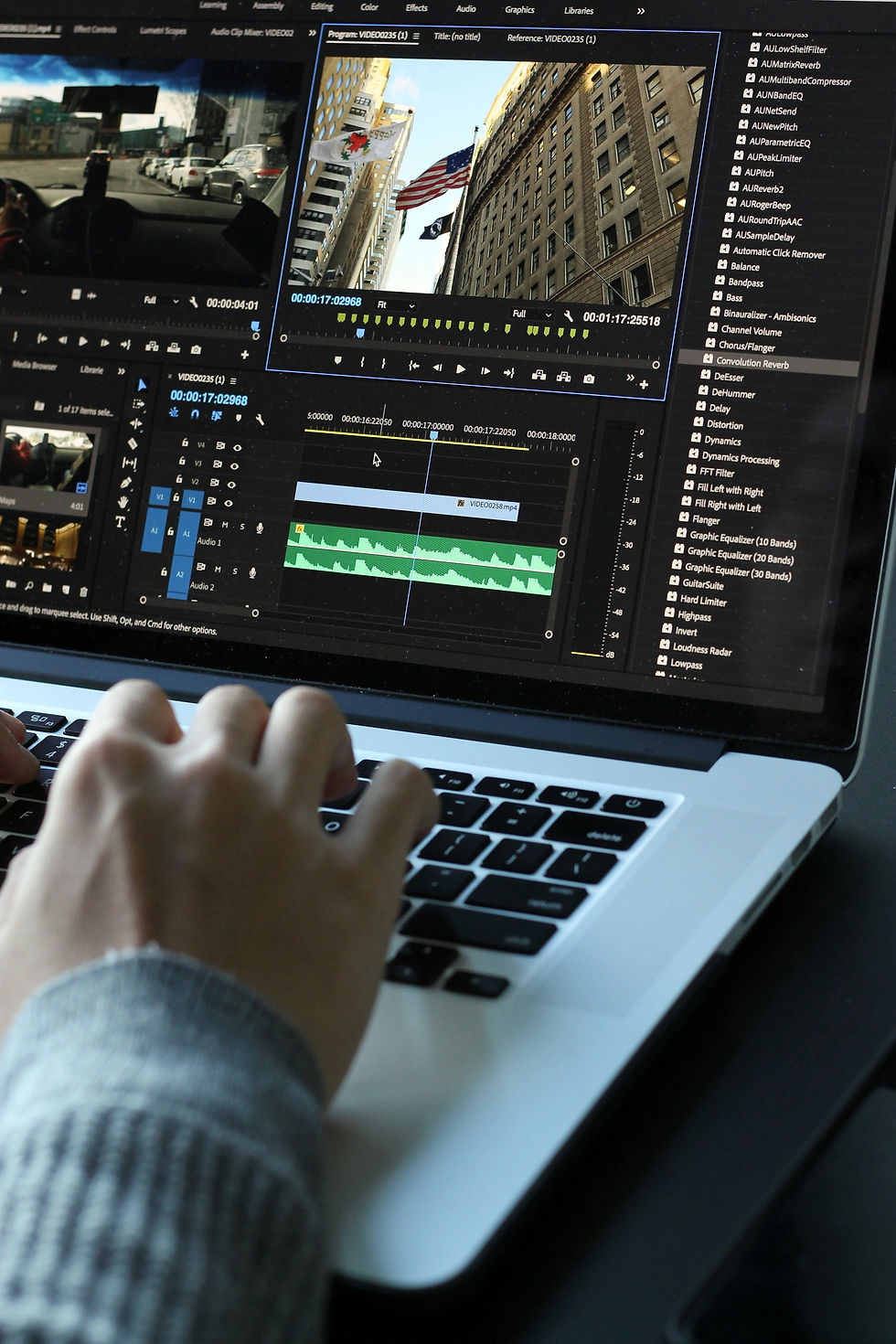 Person editing video in Adobe Premiere Pro