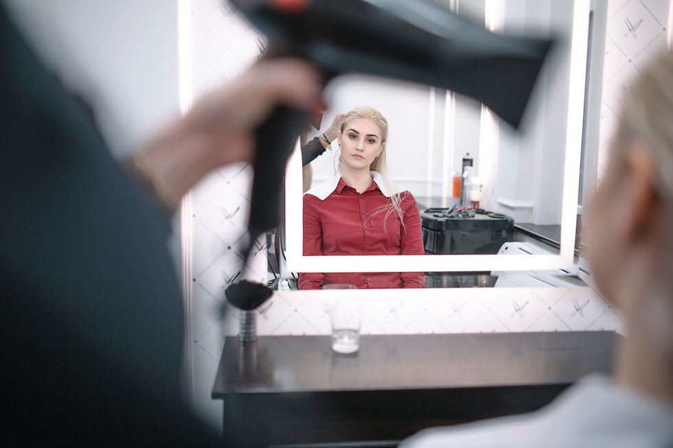 Woman getting her hair blow-dried at a beauty salon