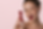 Winking woman holds Dream Beauty tube and cherry