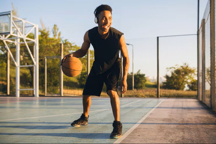 young-happy-smiling-black-man-doing-sports-playing-basketball-sunrise-listening-music-head