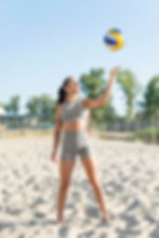 athletic woman ready to play beach volleyball in shelton ct feeling flexible and healthy with the acupuncture clinic.