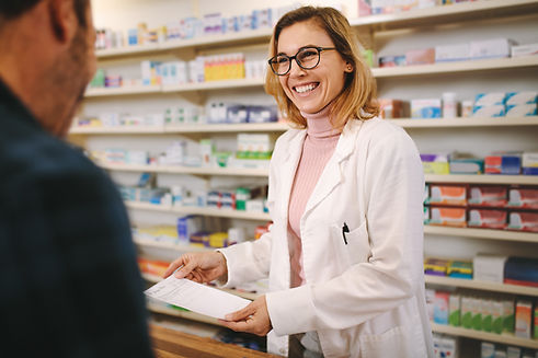 Helpful pharmacist dealing with a customer.jpeg