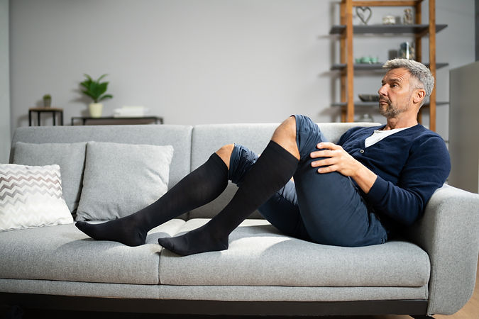 Man Wearing Medical Compression Stockings.jpeg