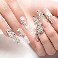 Beautifil wedding manicure for the bride in gentle tones with rhinestone
