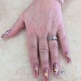 View of fingers with glitter shine acrylic nails