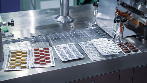 Capsule blister packing machine in pharmaceutical industrial.jpeg