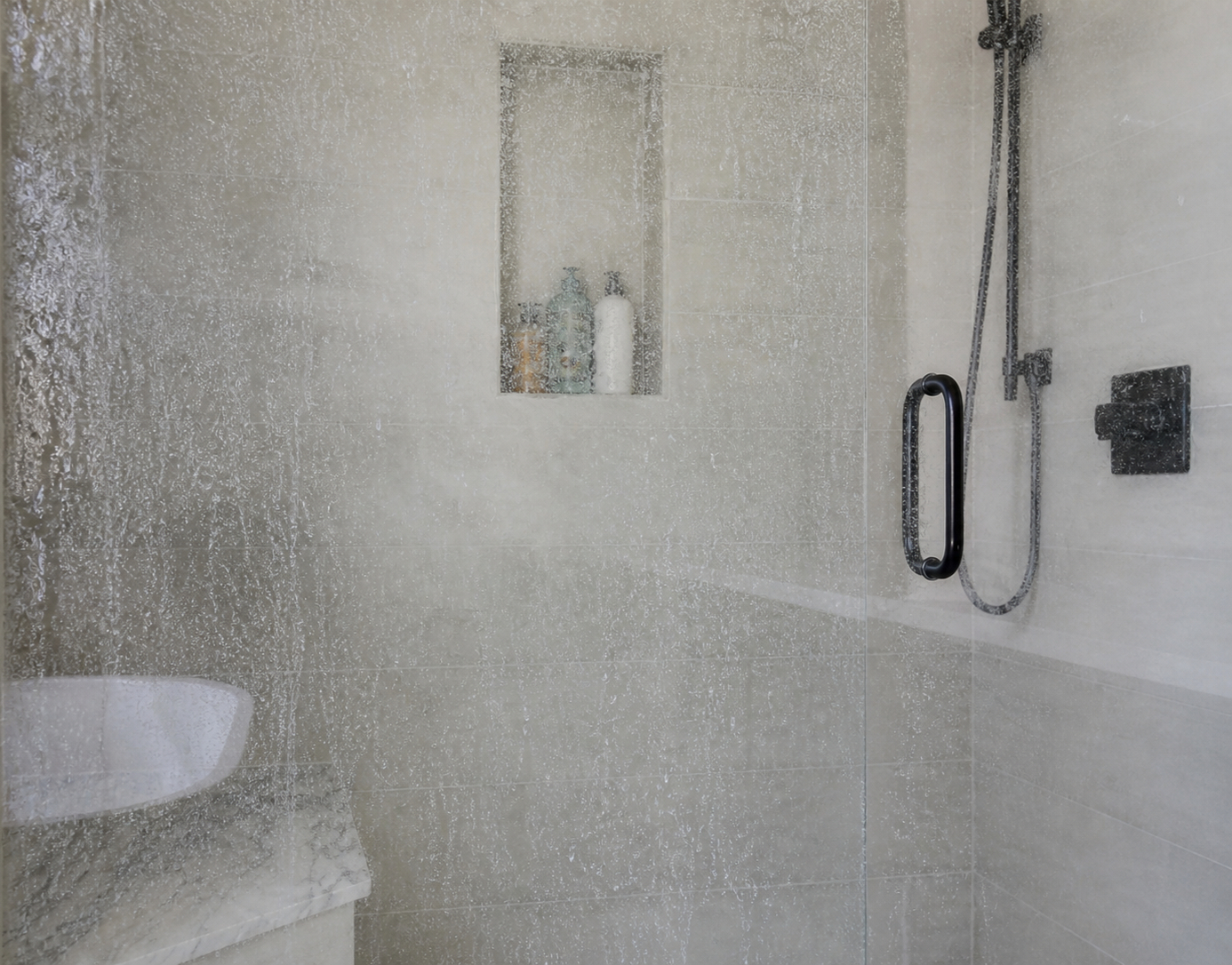 Shower screen before hydrophobic coating — soap scum and hard water marks on glass