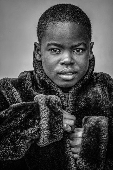 Fotoshooting und Porträtaufnahme eines afrikanischen Kindes für die Abtei Münsterschwarzach.