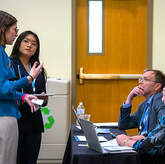 Students presenting to judges at the 2024 Collegiate SLC