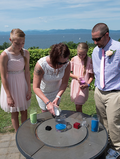 Mom pouring sand during wedding