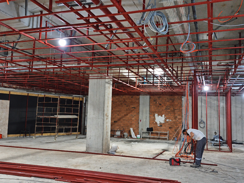 Sprinkler piping and ceiling services during construction of the Mavi store