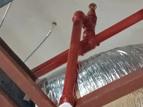 Sprinkler head and pipe connection detail in the Mavi store