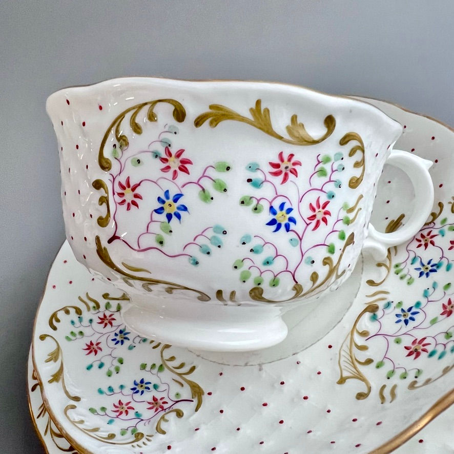 Thumbnail: Samuel Alcock breakfast cup trio, white moulded with little flowers, ca 1840