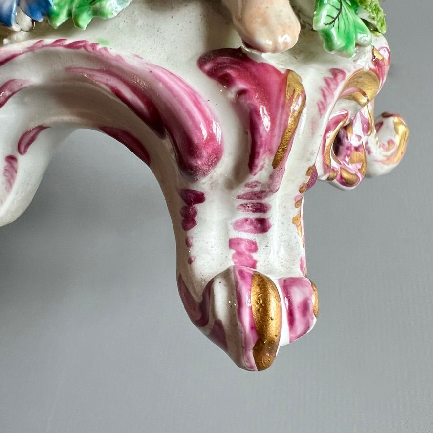 Thumbnail: Bow figure of boy putto on C-scroll base, Rococo, ca 1760