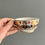 Thumbnail: Bloor Derby breakfast cup with plate, gilt with purple flowers, ca 1825