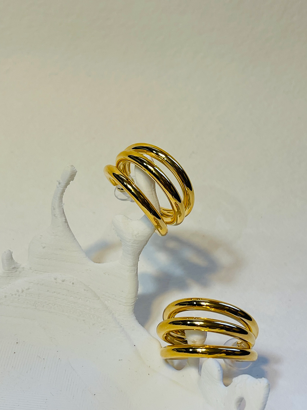 Thumbnail: Gold Triple Arc with white stone top view